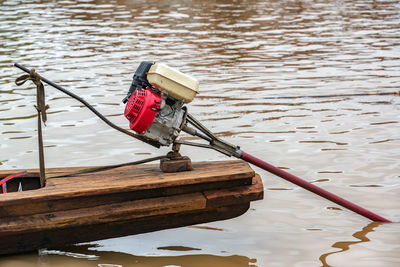 Motor on canoe in lake