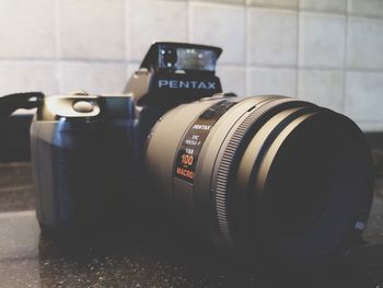 Close-up of camera on table