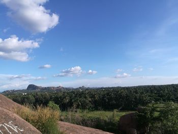 Scenic view of landscape against blue sky