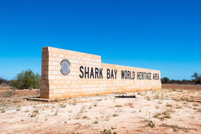 Information sign against clear sky