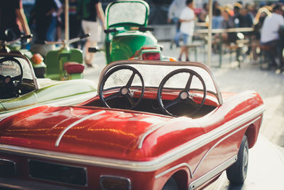 Close-up of red toy car on table