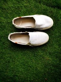 High angle view of shoes on field