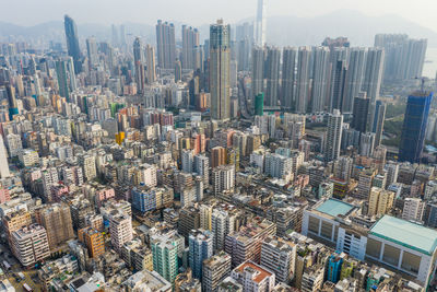 Aerial view of modern buildings in city against sky