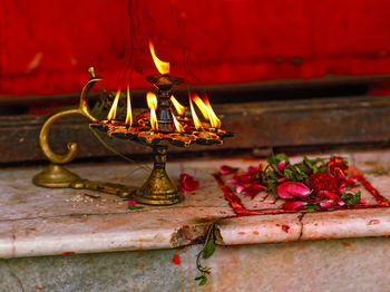 Illuminated candles on flower