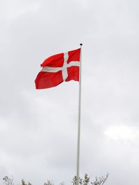 Low angle view of flag against sky