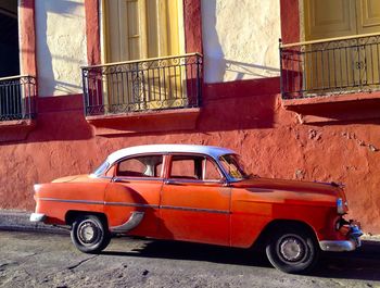 Vintage car against building in city