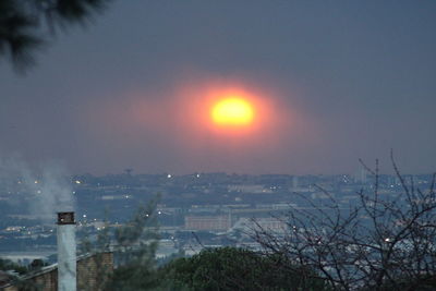 Cityscape against sky during sunset