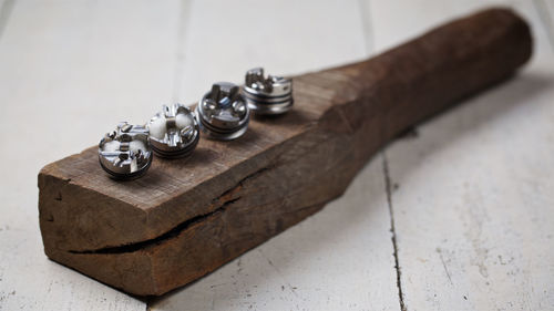 Close-up of metallic equipment on wood