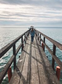 Pier over sea against sky