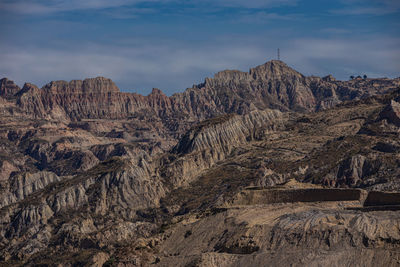 Panoramic view of rocky mountains against sky