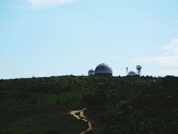 Built structure on landscape against clear sky