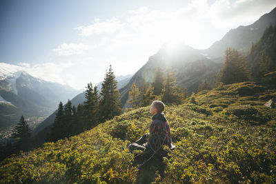 Female hiker relaxing at mountains