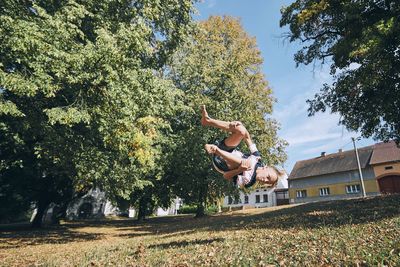 Man playing plants against sky