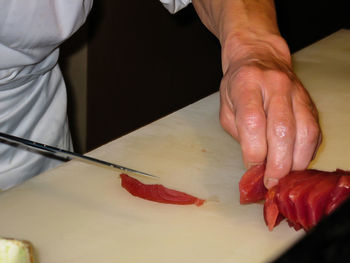 Close-up of man preparing food