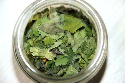 High angle view of leaf vegetable in jar on table