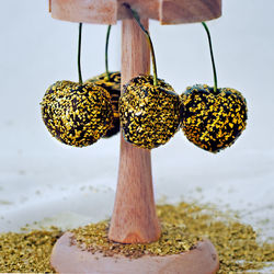 Close-up of   hanging golden edible cherries
