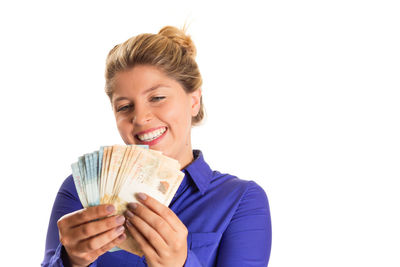 Portrait of a smiling young woman over white background