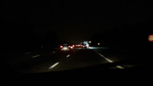 Cars on road at night