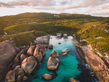 High angle view of rocks in sea against sky