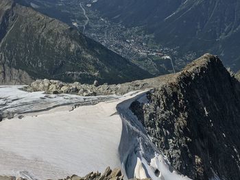 High angle view of sea by mountains