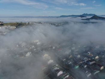 Aerial view of cityscape against sky