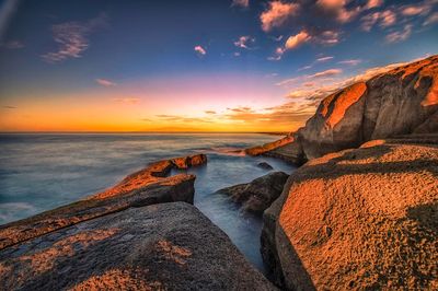 Scenic view of sea against sky during sunset