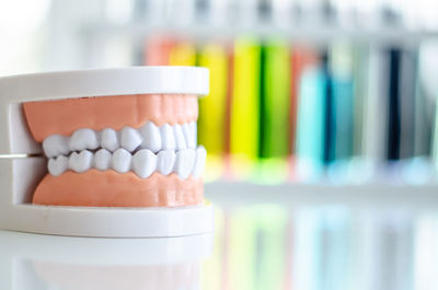 Close-up of dentures on table at medical clinic