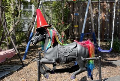 Multi colored horse cart in playground