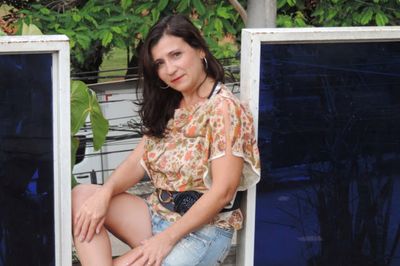 Portrait of smiling woman standing outdoors