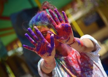 Close-up of hand covered in powder paint