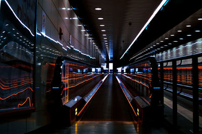 Empty illuminated underground walkway