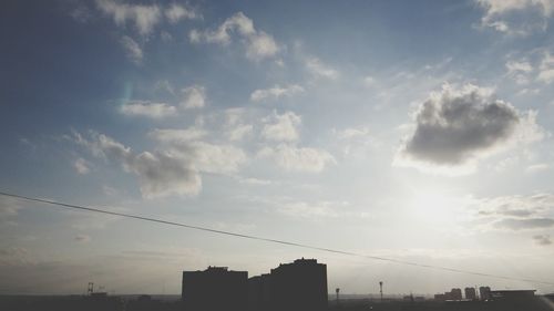 Low angle view of cables against sky