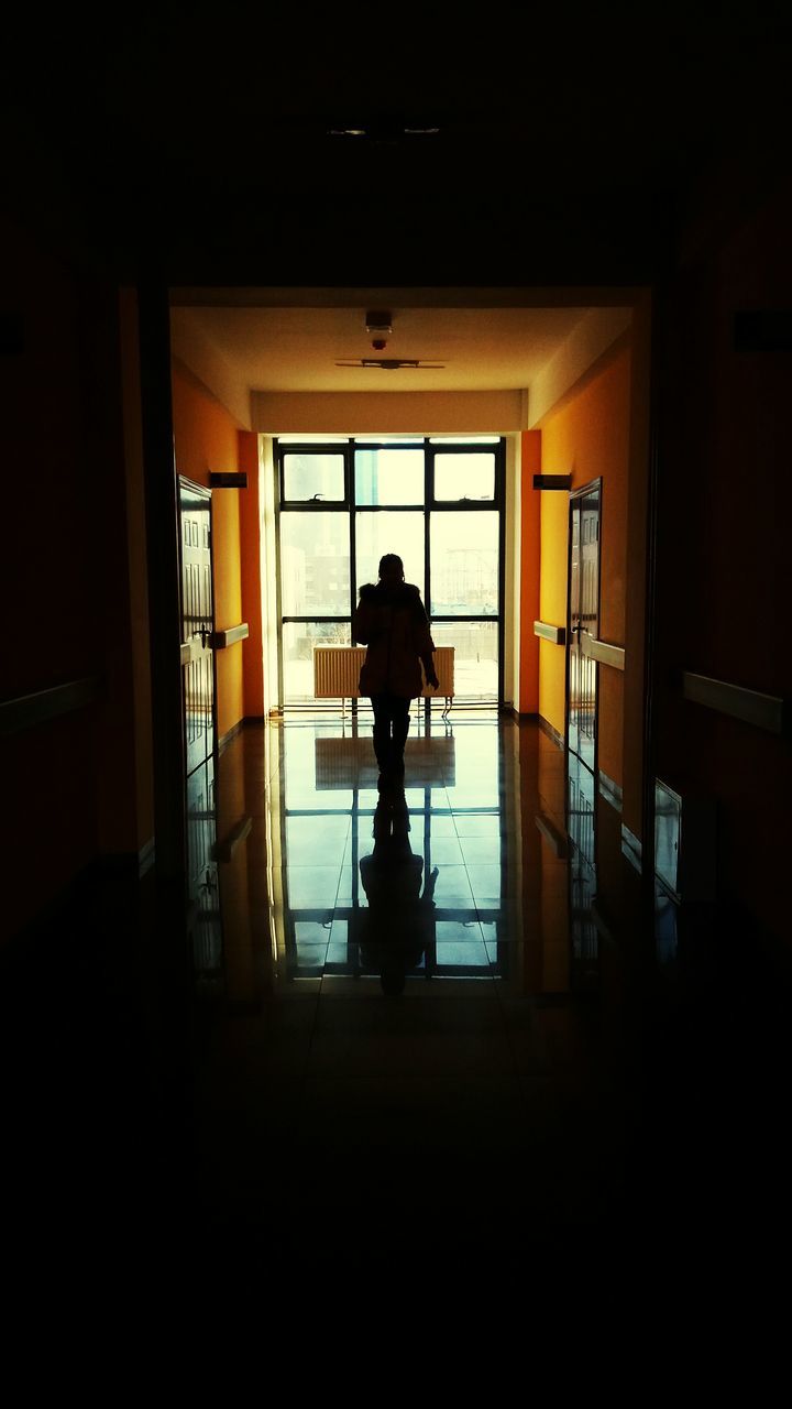 indoors, silhouette, full length, window, lifestyles, standing, men, dark, architecture, built structure, rear view, leisure activity, door, person, walking, sunlight, shadow, side view