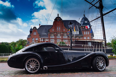 Vintage car against buildings in city