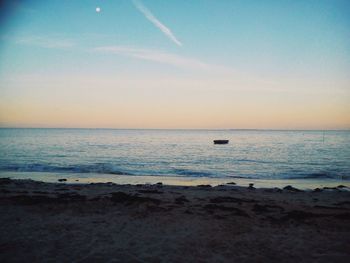 Scenic view of sea at sunset