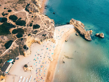 Ocean landscape with rocks and cliffs at lagos bay coast in algarve, portugal