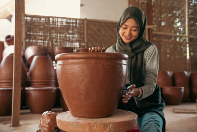 Portrait of young woman standing in temple