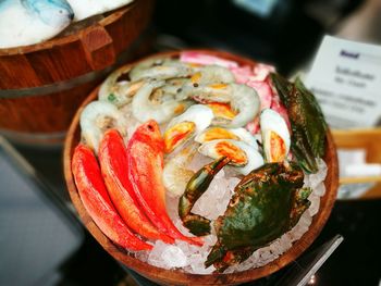 Close-up of fish on crushed ice in container