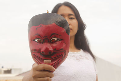 Side view of young man wearing mask