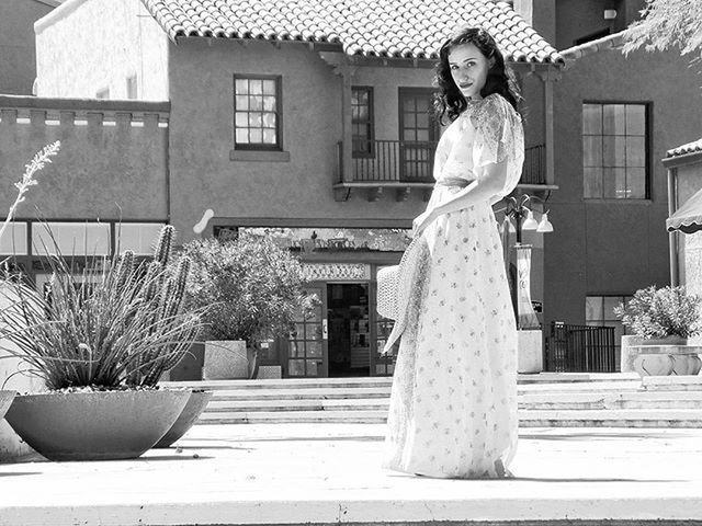 PORTRAIT OF YOUNG WOMAN STANDING ON WALL