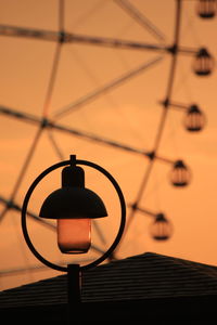 Ferris wheel and street lamp