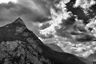Scenic view of mountains against cloudy sky