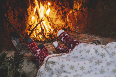 Low angle view of bonfire on bed at home