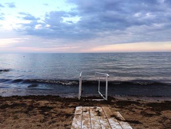 Scenic view of sea against cloudy sky