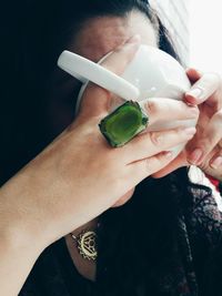 Close-up of woman drinking tea