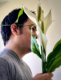 Close-up of woman holding flower