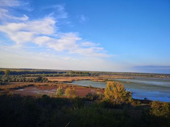 Scenic view of beach against blue sky