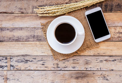 High angle view of coffee cup on table