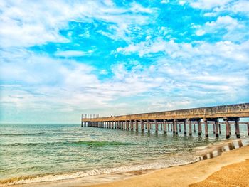 Pier over sea against sky