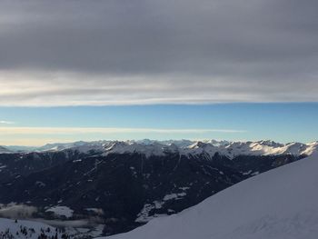 Scenic view of snow covered mountains against sky